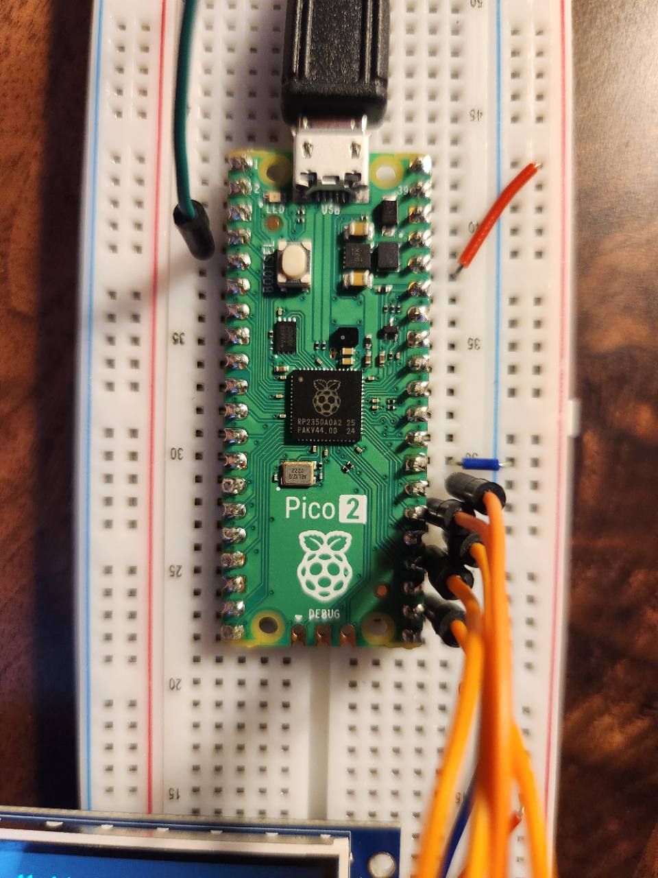 Close-up of a Raspberry Pi Pico 2 mounted on a breadboard